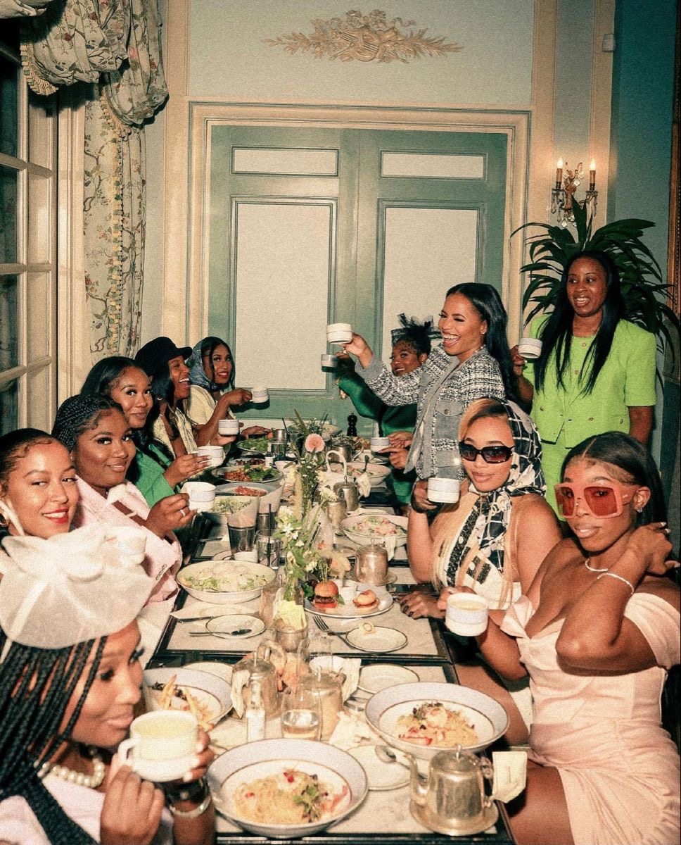 Reel to Table members smiling around a supper club table
